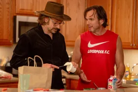 Bradley Cooper, left, and Will Arnett appear in a scene from the new comedy/drama "Is This Thing On?" 