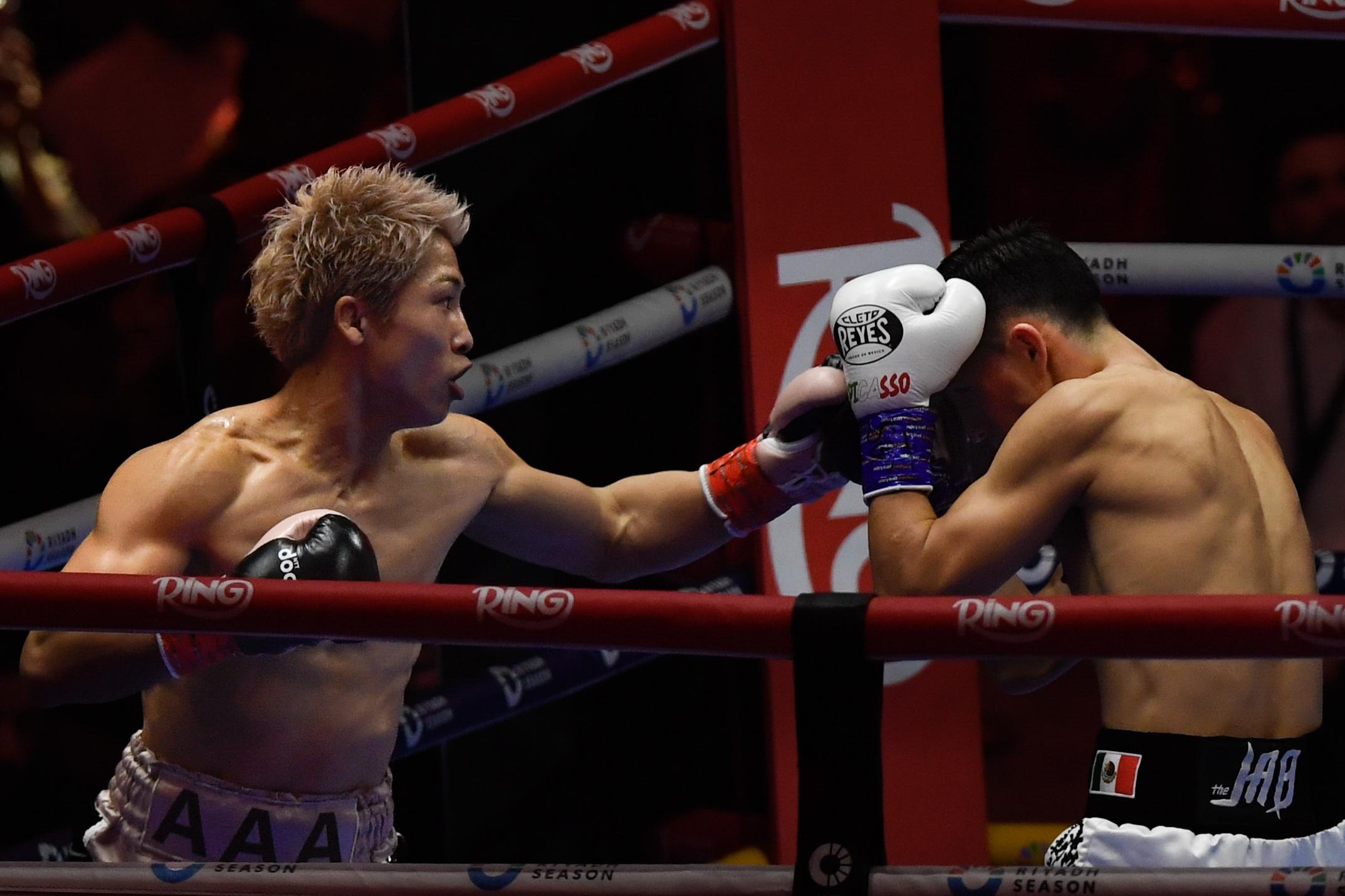 Japan’s Naoya Inoue, left, punches Alan Picasso of Mexico during...