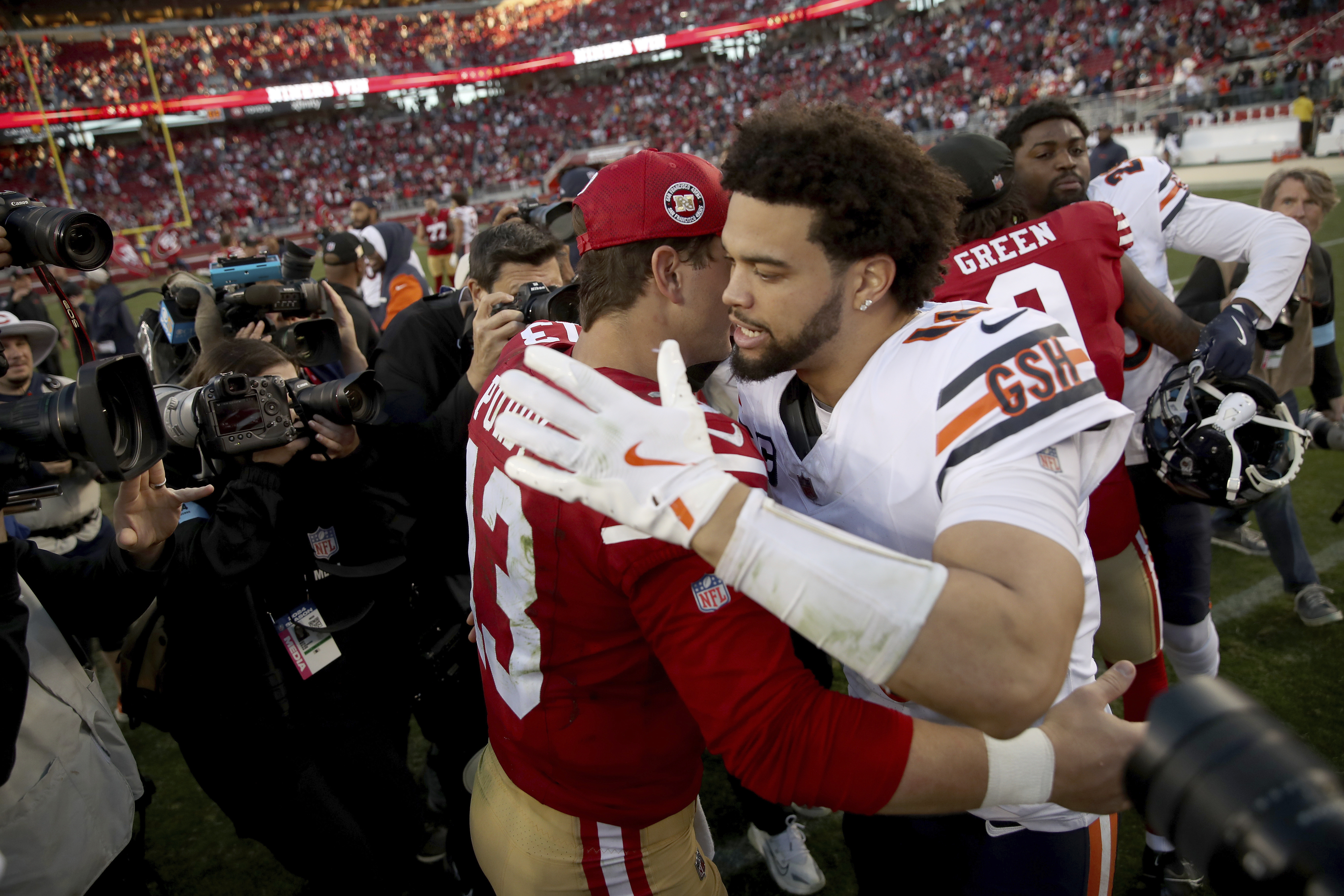 San Francisco 49ers quarterback Brock Purdy (13) and Chicago Bears quarterback Caleb Williams (18) greet each other after an NFL football game, Sunday, December 8, 2024, in Santa Clara, Calif. (AP Photo/Scot Tucker)