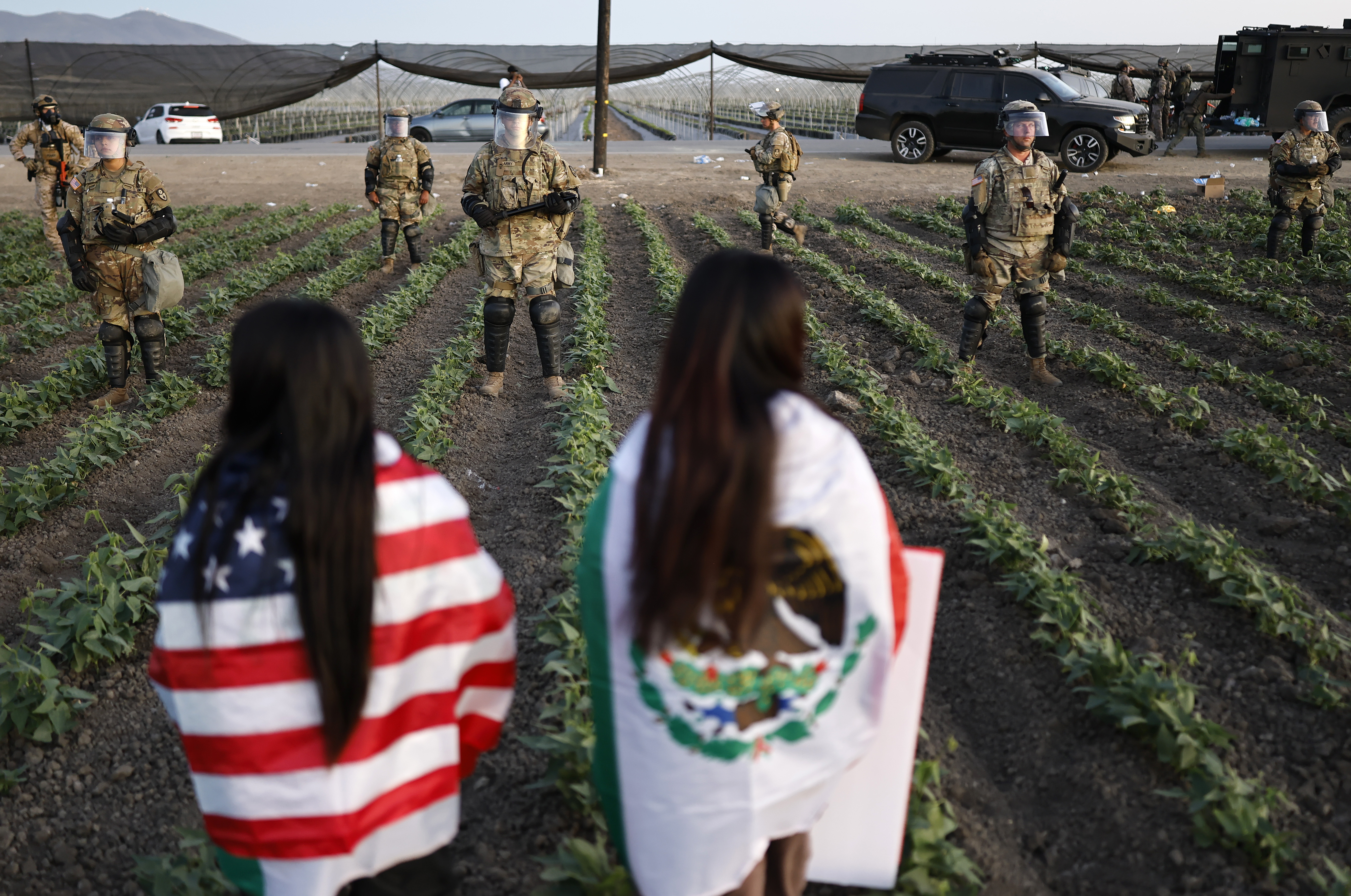 National Guard soldiers block protesters during an ICE-led immigration raid at a farm near Camarillo in July.