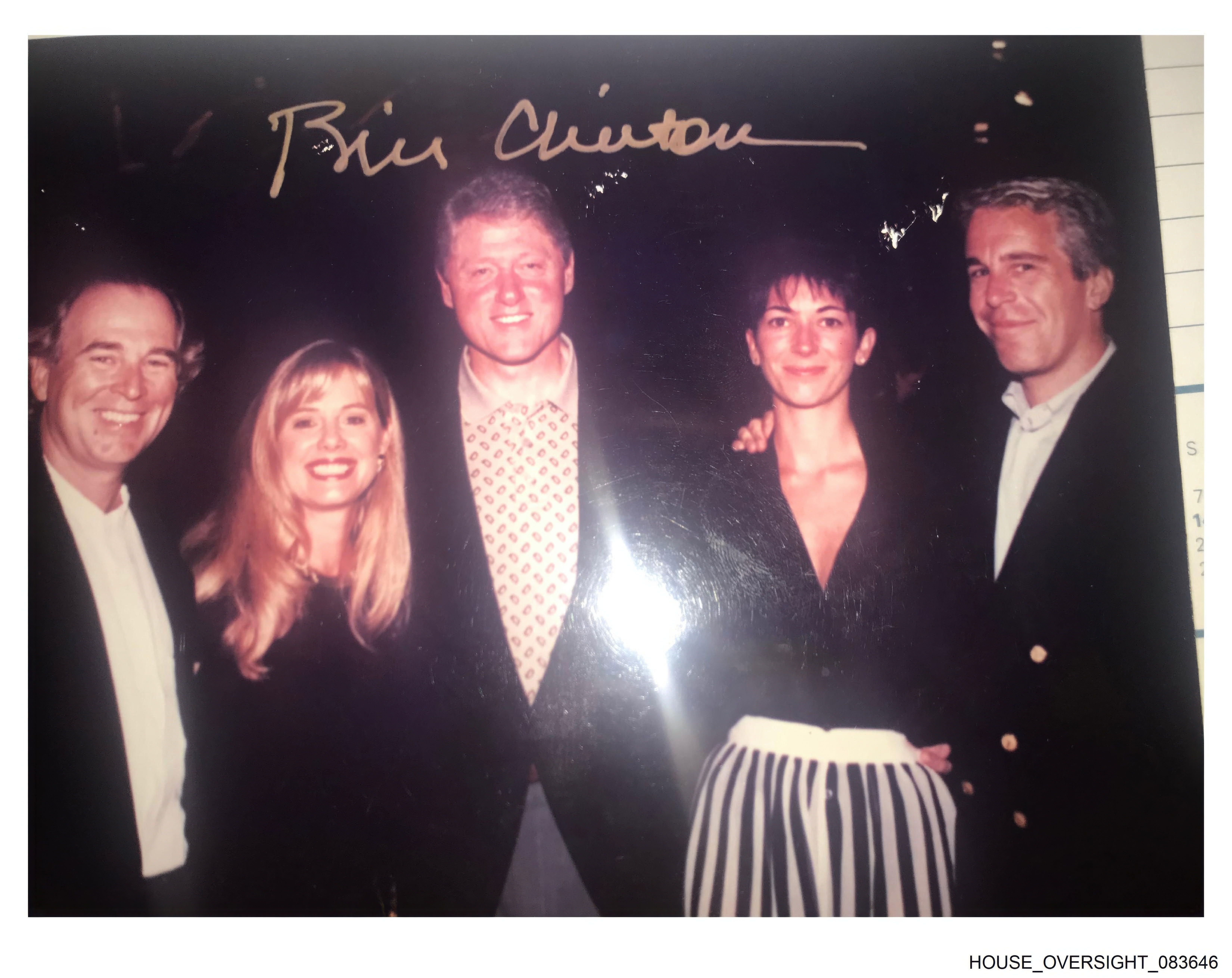 This undated photo released by Democrats on the House Oversight Committee shows former President Bill Clinton, Ghislaine Maxwell and Jeffrey Epstein, with Clinton's signature at the top of the photo. 