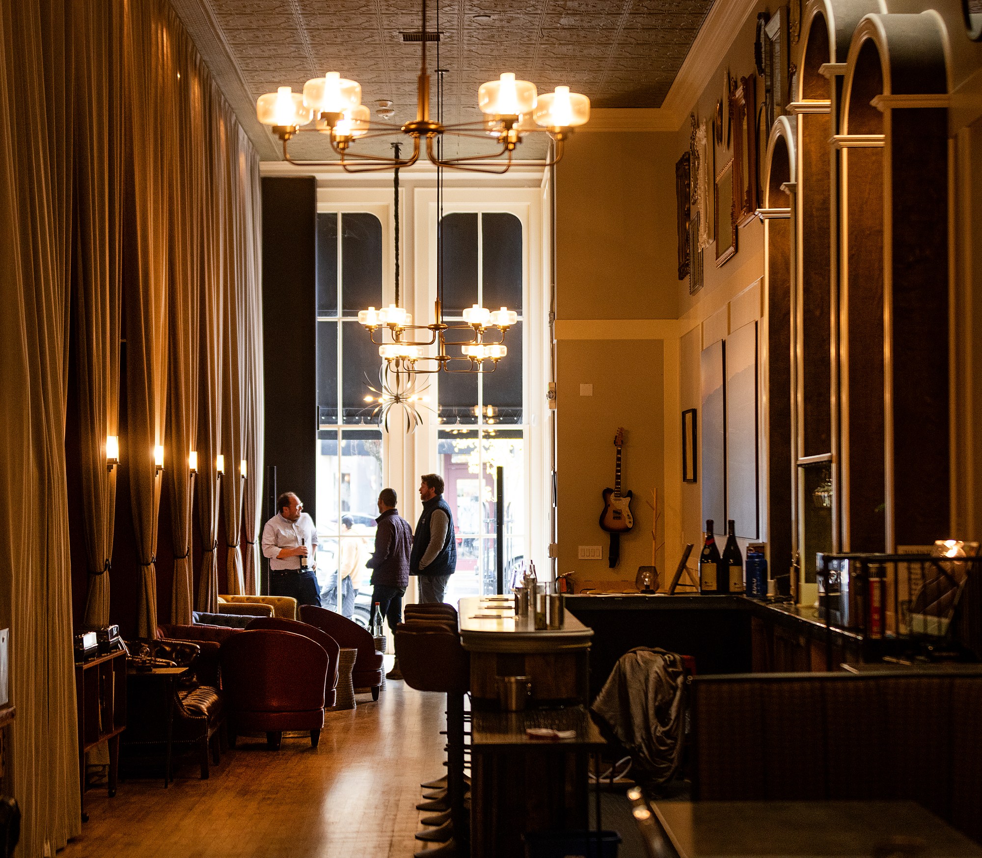 Cobb Wines tasting room director Andy Copeland talks about the different designated vineyards used in their coastal pinots Wed., Dec.10, 2025 at their new tasting room in Healdsburg. (John Burgess / The Press Democrat)
